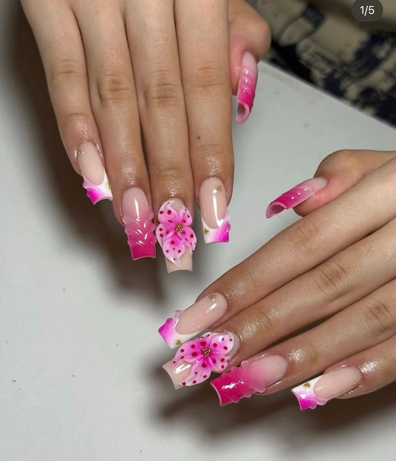 Pink floral nail art created at Rushden Nails